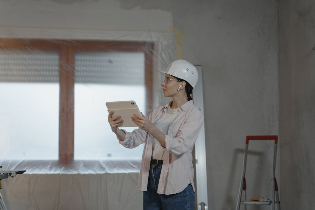 A kitchen remodeling professional examining a space